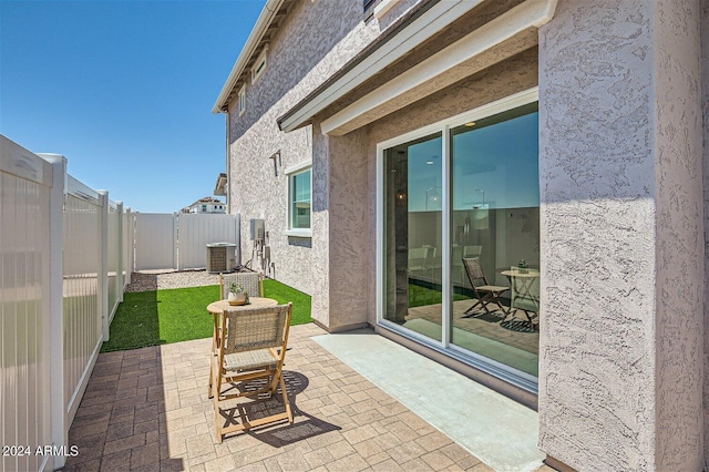 view of patio / terrace featuring cooling unit