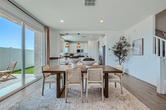 dining room with light hardwood / wood-style flooring