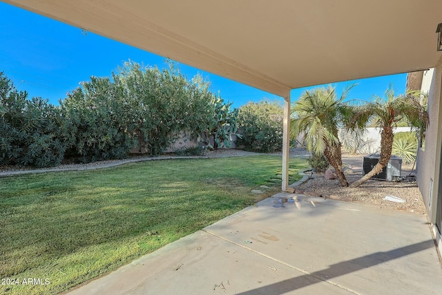 view of yard featuring a patio and central AC