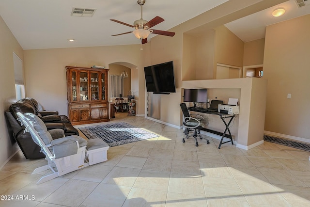 home office with ceiling fan, light tile patterned floors, and high vaulted ceiling