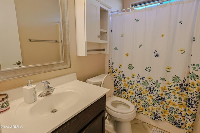 bathroom featuring tile patterned flooring, vanity, a shower with shower curtain, and toilet