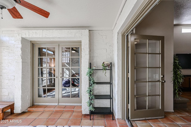 property entrance with french doors and ceiling fan