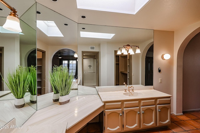 bathroom with vanity and tile patterned floors