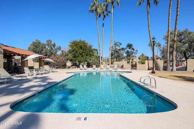 view of swimming pool featuring a patio