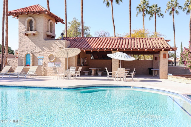 view of swimming pool featuring a patio area