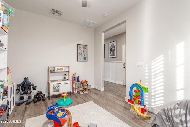 playroom with light hardwood / wood-style floors