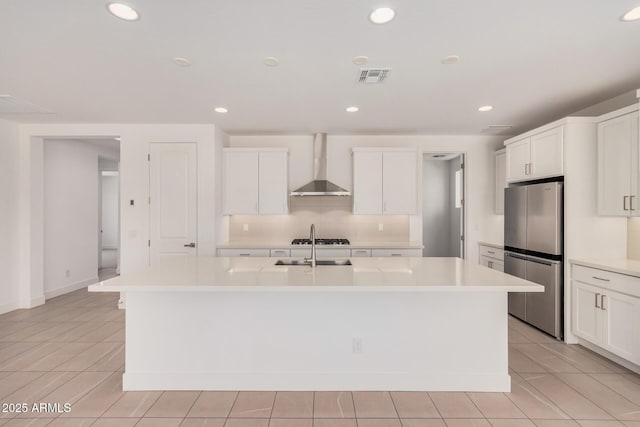 19354 S 212th Pl, Queen Creek, AZ 85142 - kitchen with stainless steel appliances, wall chimney exhaust hood, a center island with sink, light countertops, and recessed lighting