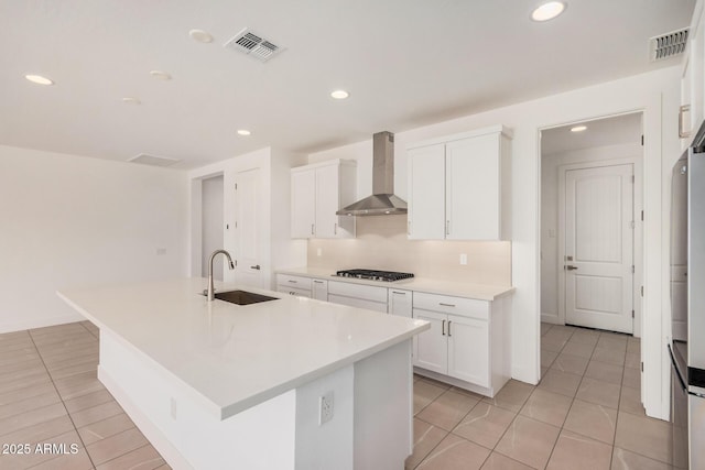 19354 S 212th Pl, Queen Creek, AZ 85142 - kitchen with wall chimney range hood, light tile patterned floors, white cabinets, and recessed lighting
