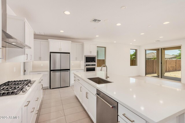 19354 S 212th Pl, Queen Creek, AZ 85142 - kitchen with stainless steel appliances, wall chimney exhaust hood, light countertops, white cabinets, and recessed lighting