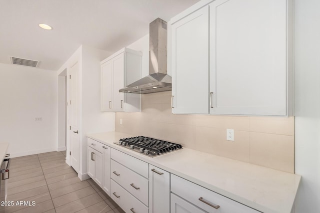 19354 S 212th Pl, Queen Creek, AZ 85142 - kitchen with wall chimney range hood, stainless steel gas cooktop, white cabinetry, light countertops, and recessed lighting
