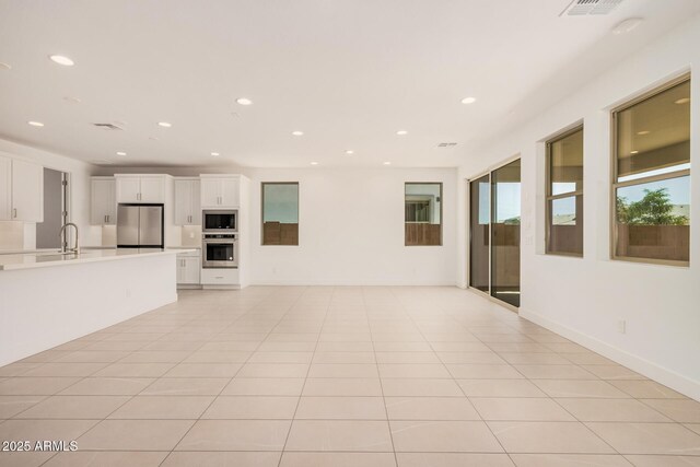 19354 S 212th Pl, Queen Creek, AZ 85142 - unfurnished living room featuring a sink and recessed lighting