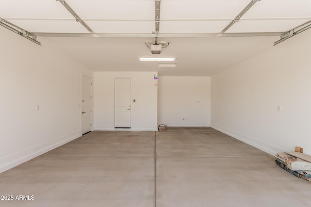 19354 S 212th Pl, Queen Creek, AZ 85142 - garage featuring a garage door opener and baseboards