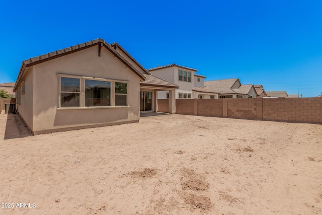 19354 S 212th Pl, Queen Creek, AZ 85142 - rear view of house featuring stucco siding, a fenced backyard, and a tiled roof
