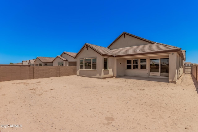19354 S 212th Pl, Queen Creek, AZ 85142 - rear view of property featuring a tile roof, stucco siding, a fenced backyard, and a patio area