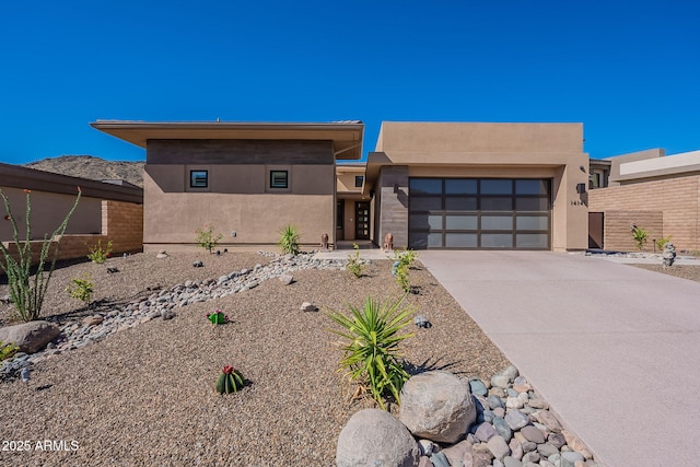 14141 E Highland Ave, Fountain Hills, AZ 85268 - view of front of property with a garage, stucco siding, and driveway