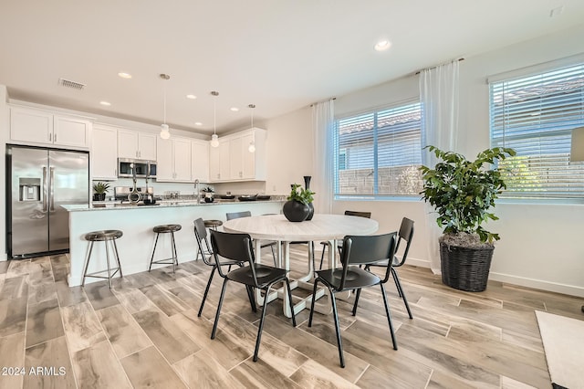 dining space featuring light hardwood / wood-style flooring