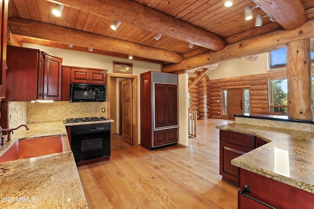 kitchen featuring wood ceiling, a sink, range, rustic walls, and black microwave