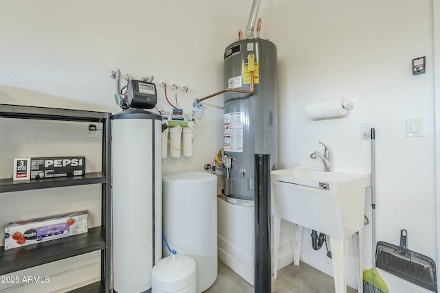 utility room with sink and water heater