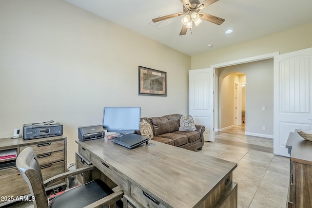 tiled office space featuring ceiling fan