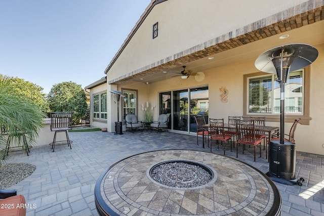 back of house with a patio area and ceiling fan