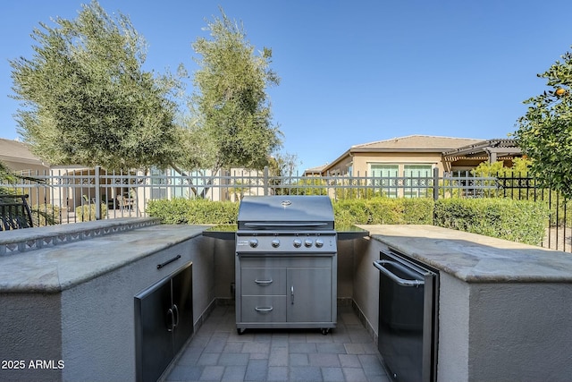 view of patio / terrace featuring area for grilling and an outdoor kitchen