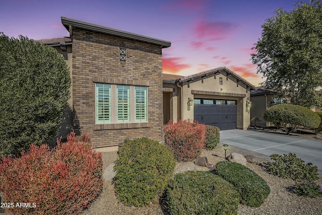 view of front of property with a garage