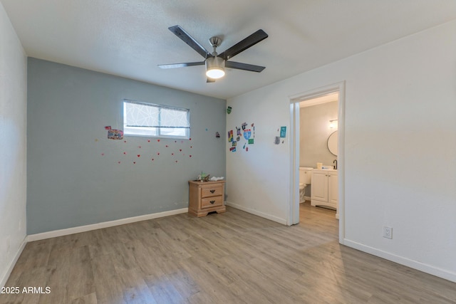 2608 W Pierson St, Phoenix, AZ 85017 - unfurnished bedroom featuring light wood-type flooring, a ceiling fan, and connected bathroom