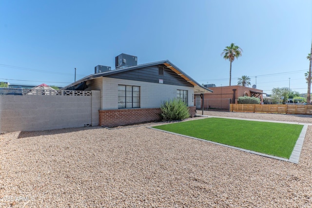 2608 W Pierson St, Phoenix, AZ 85017 - back of house with a fenced backyard and brick siding