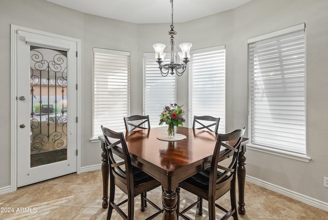 dining area with an inviting chandelier