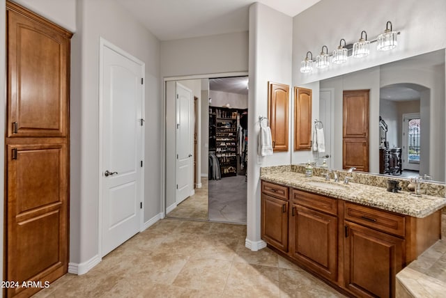 bathroom featuring tile patterned flooring and vanity