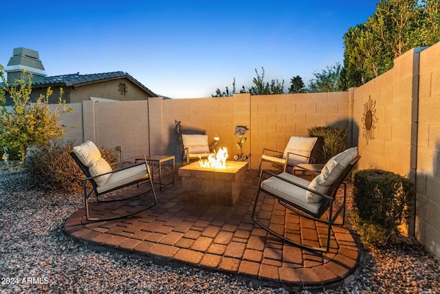 view of patio / terrace featuring an outdoor fire pit