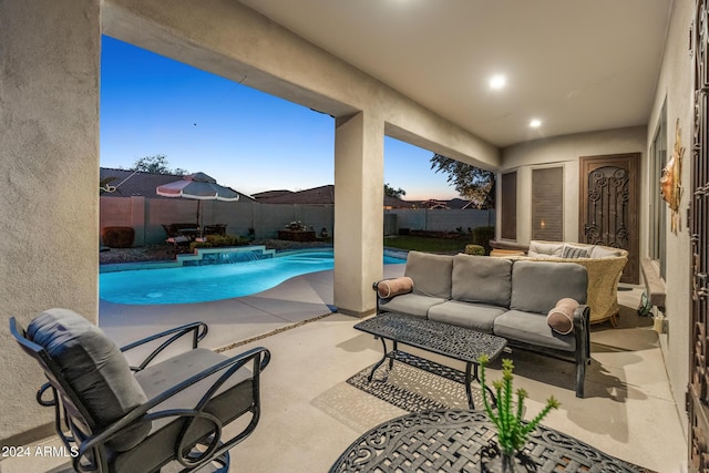 view of pool with a patio area and an outdoor living space