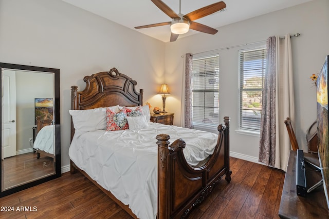 bedroom featuring ceiling fan and dark wood-type flooring