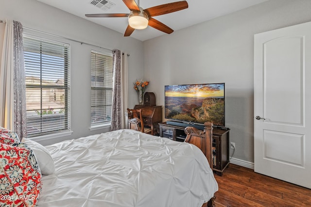 bedroom with ceiling fan and dark wood-type flooring