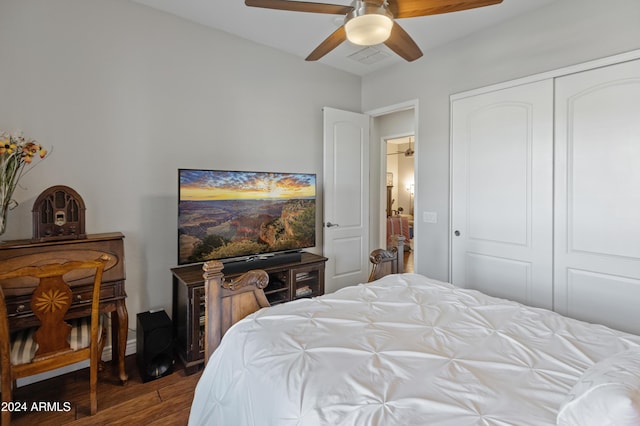 bedroom with ceiling fan, a closet, and dark wood-type flooring