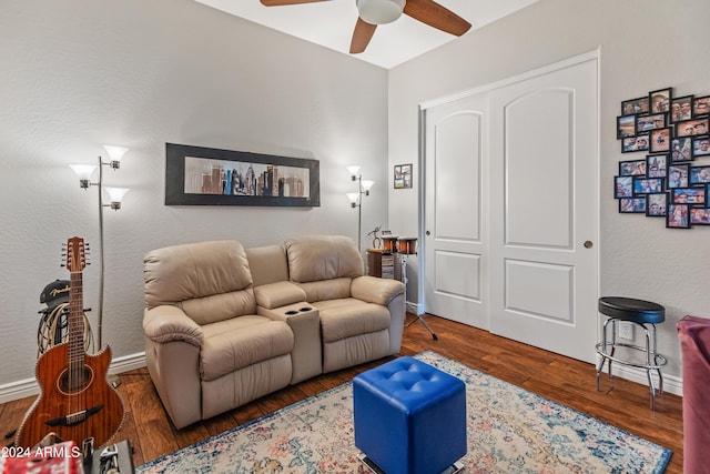 living room with ceiling fan and wood-type flooring