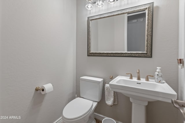 bathroom with sink and toilet