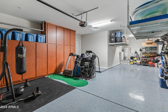 garage featuring a garage door opener and water heater