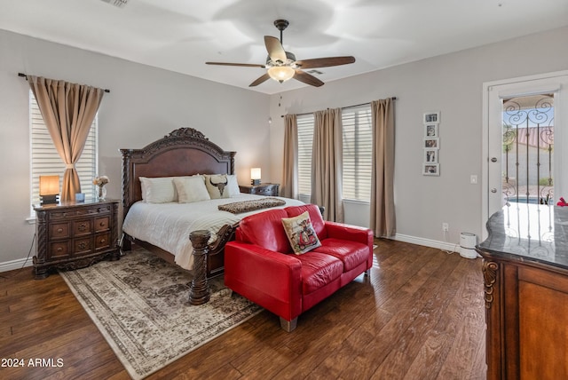 bedroom with access to exterior, multiple windows, dark wood-type flooring, and ceiling fan