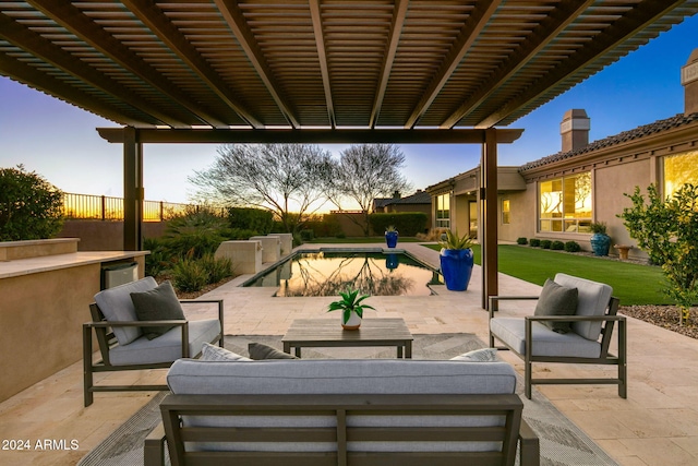 patio terrace at dusk featuring an outdoor hangout area and a pergola