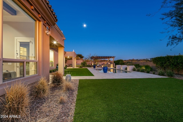 view of yard with a pergola and a patio area