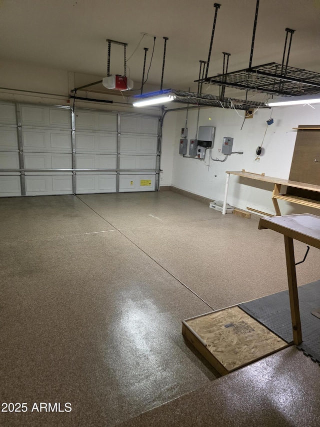 22508 W Antelope Trl, Buckeye, AZ 85326 - garage featuring a garage door opener and baseboards