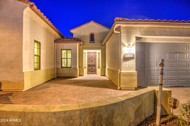 patio at night with a garage