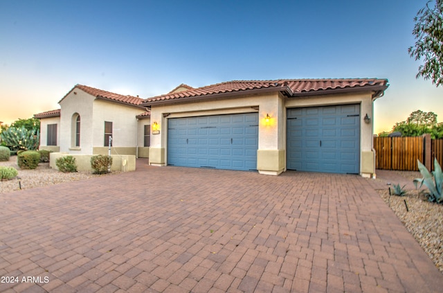 mediterranean / spanish-style house featuring a garage