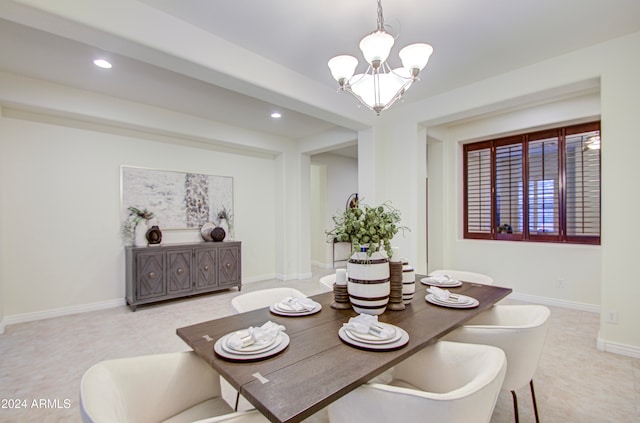 dining area featuring a chandelier