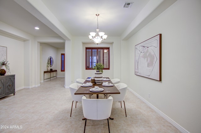 dining room with a notable chandelier