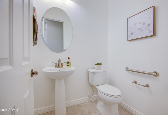 bathroom with tile patterned floors and toilet