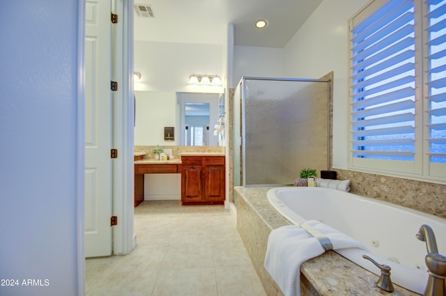 bathroom with vanity, tile patterned floors, and shower with separate bathtub