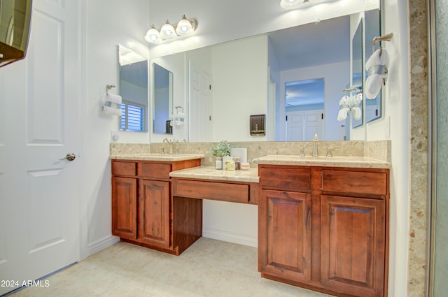 bathroom featuring tile patterned flooring and vanity