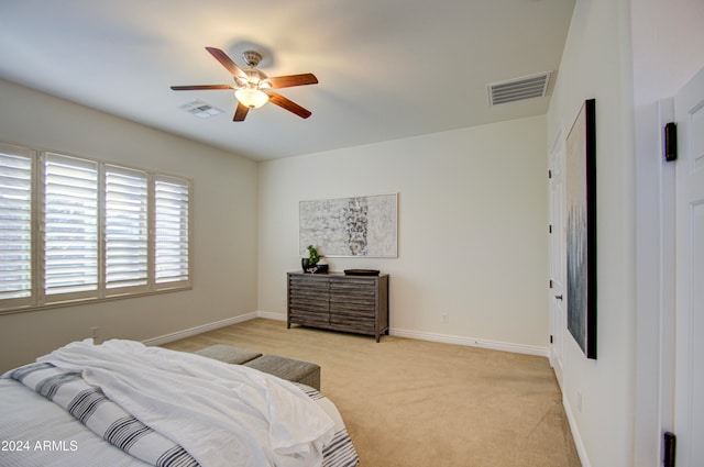 bedroom featuring light colored carpet and ceiling fan